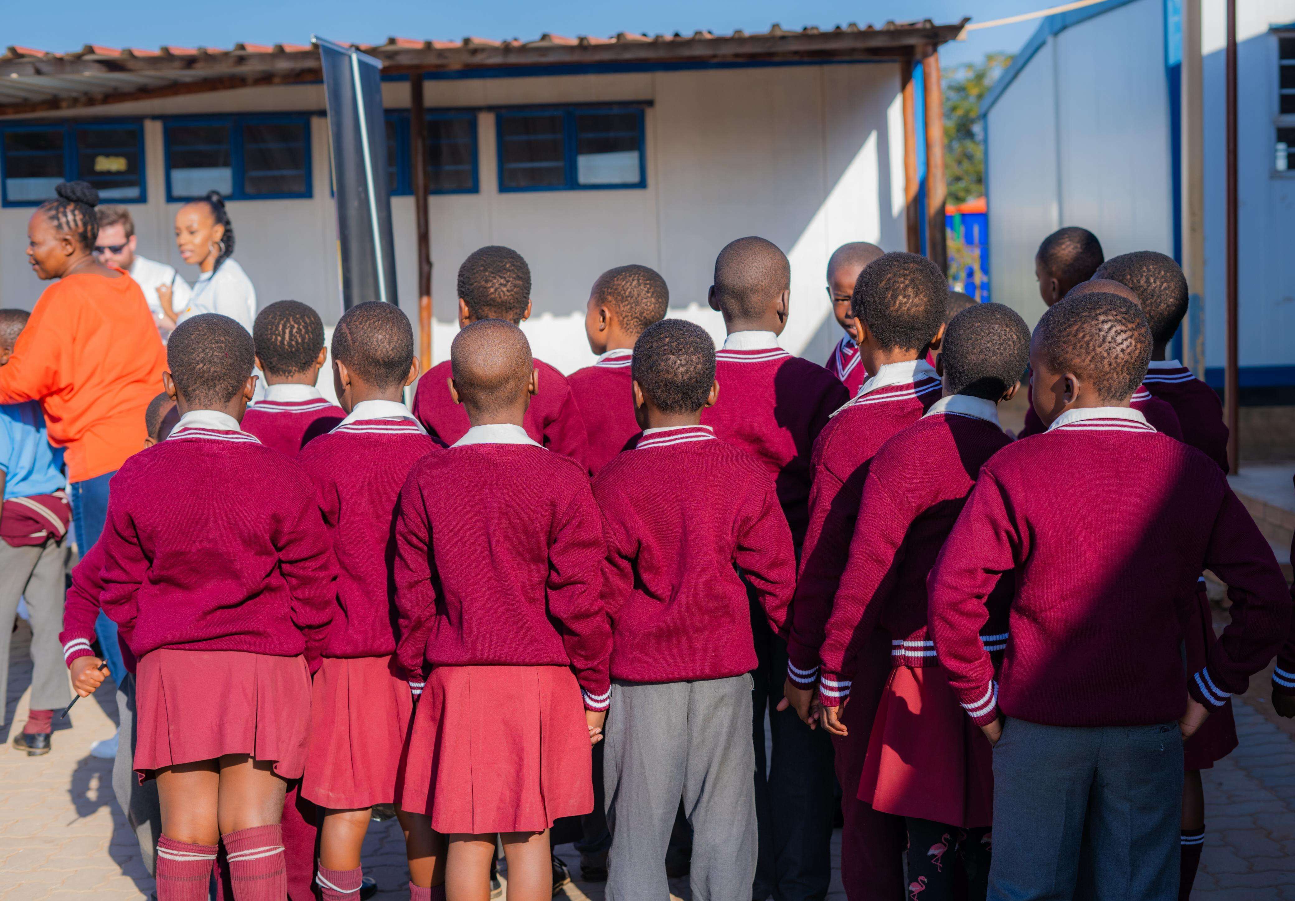 Students in school uniforms at 1000 Uniforms Initiative
