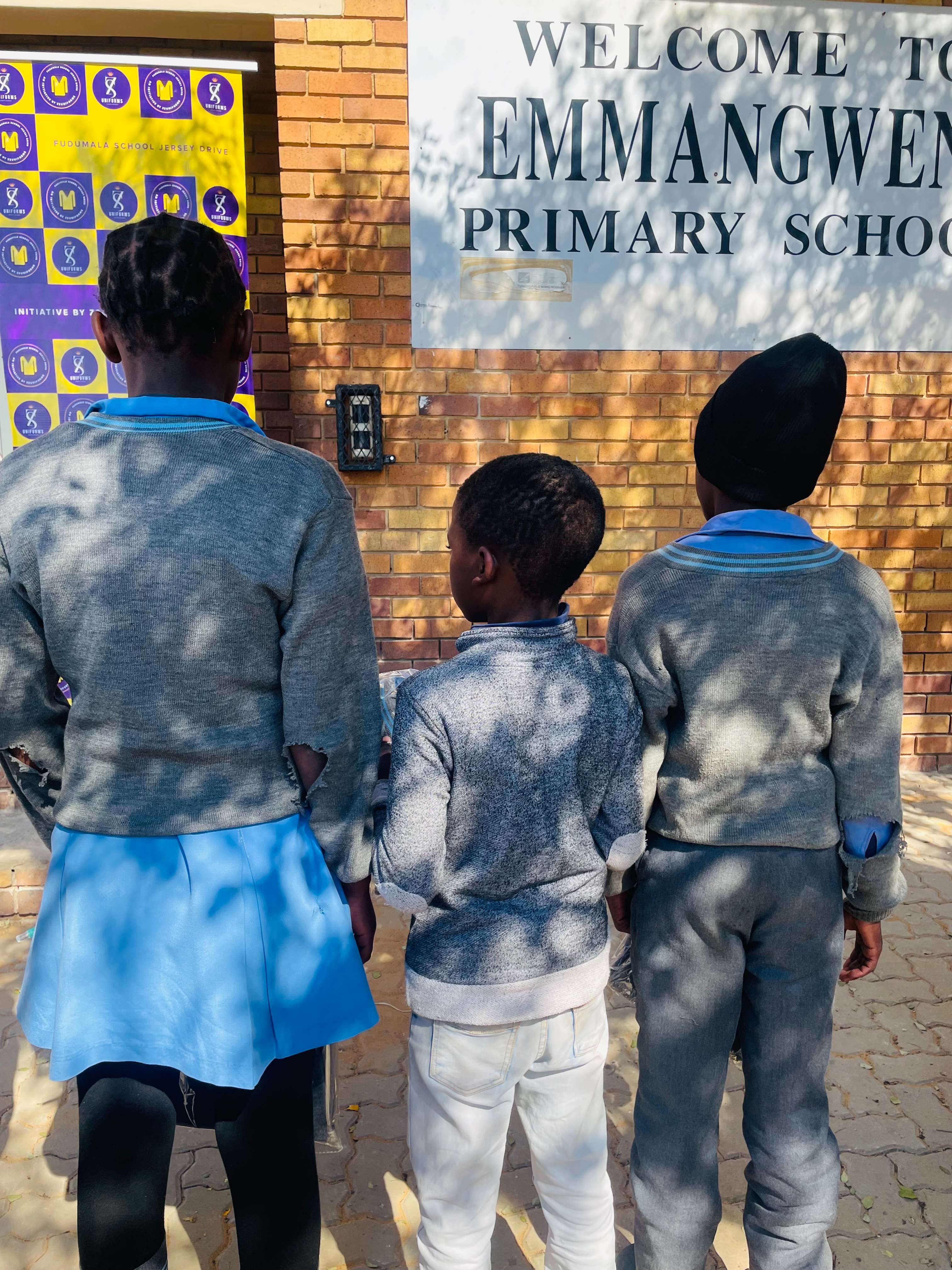 Students proudly wearing their new uniforms